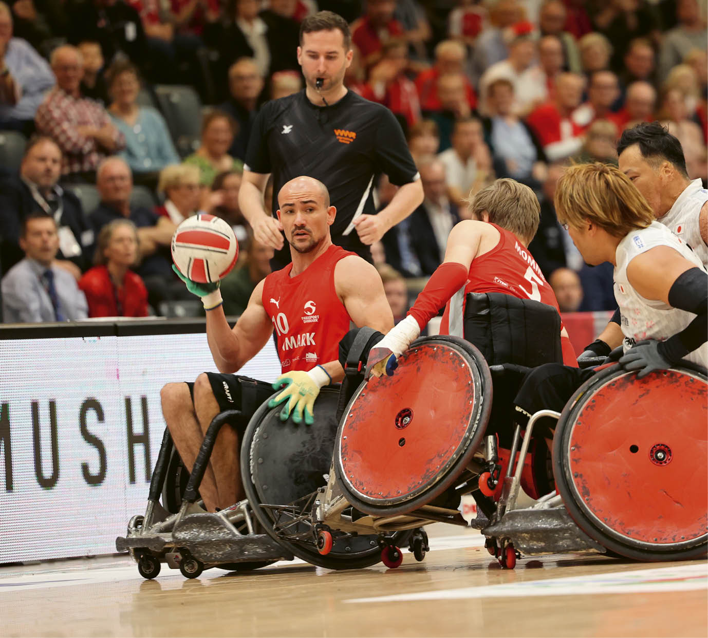 A group of people in wheelchairs. Description generated by AI